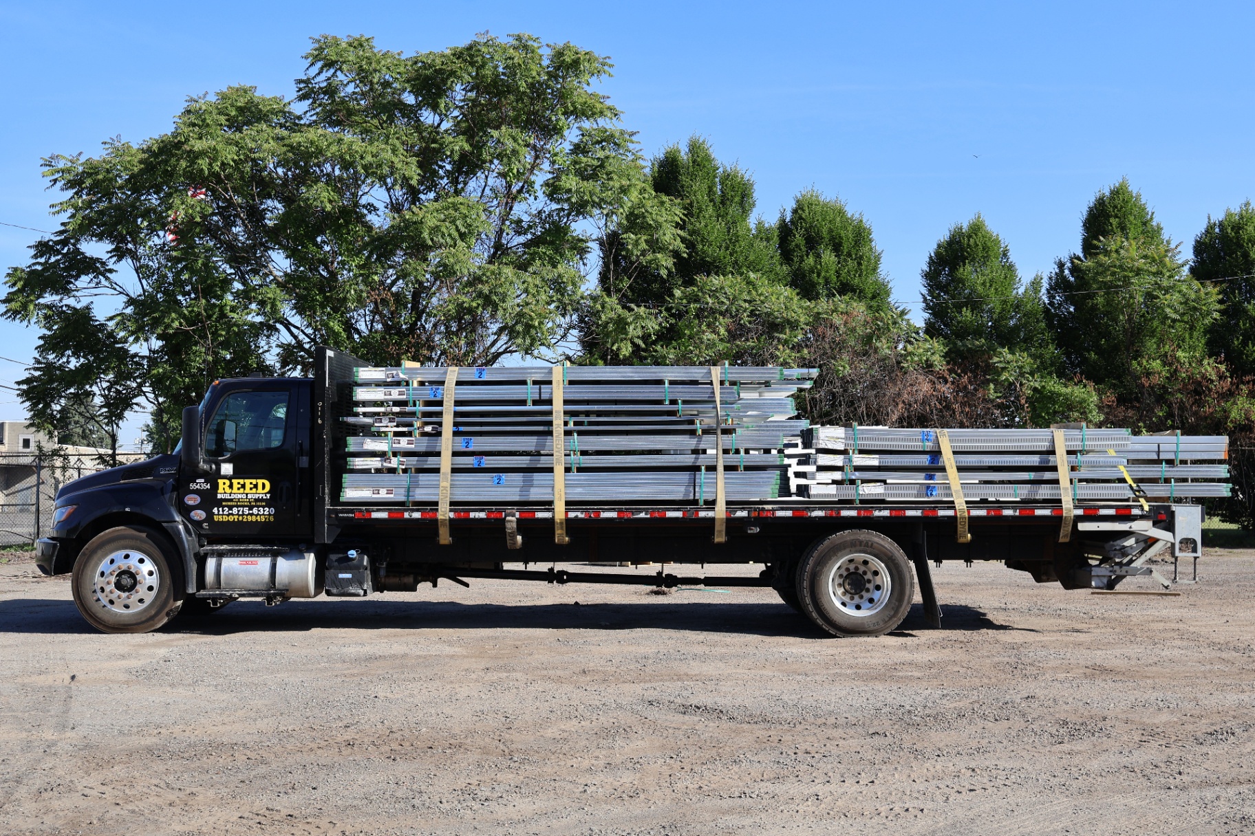 Reed Building Supply flatbed loaded with metal studs