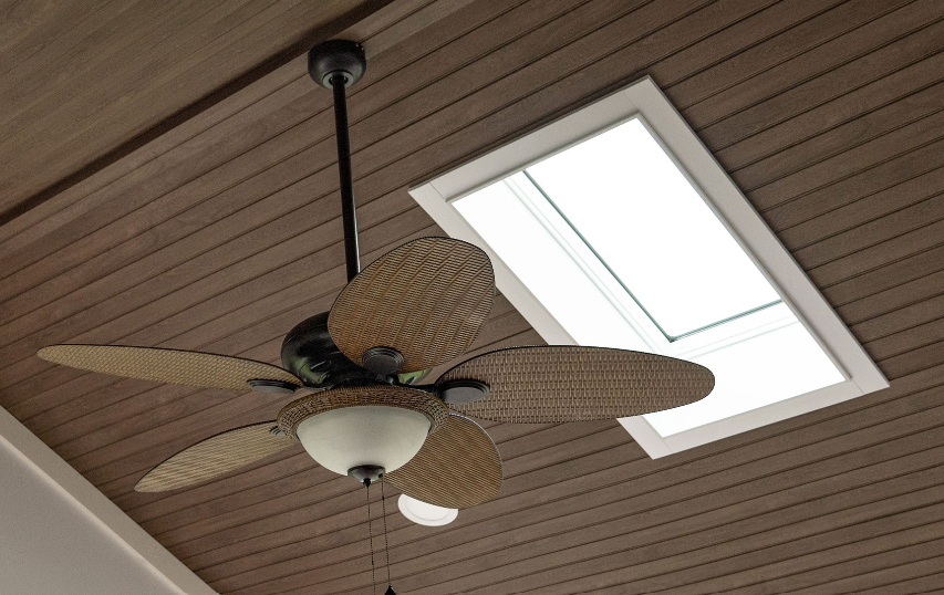 Alpine wood-look ceiling with skylight and fan