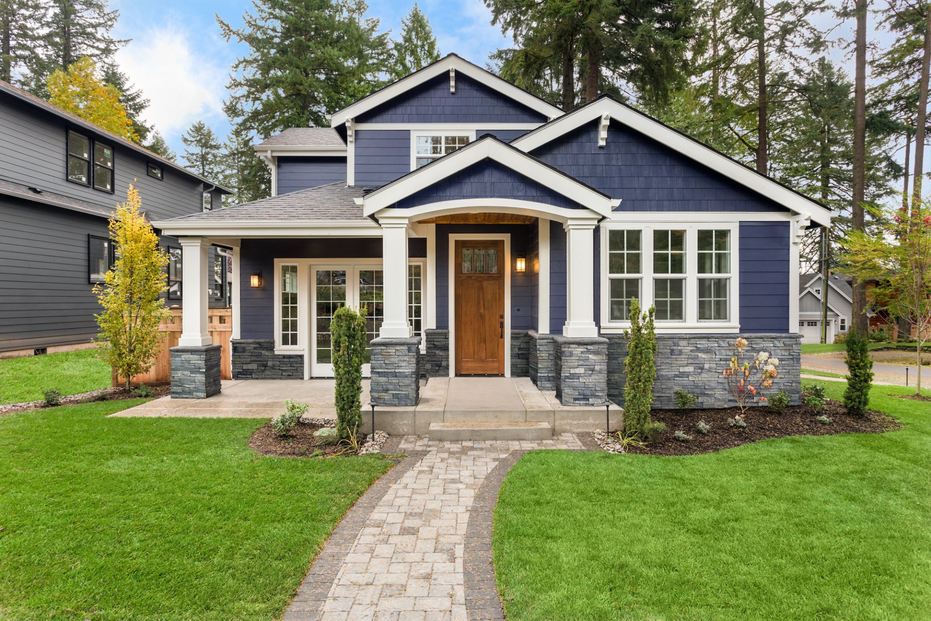 Home exterior featuring stone veneer accents